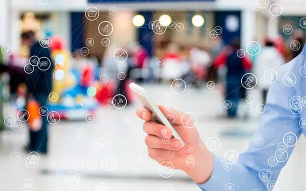 Illustrative art shows a person with a cell phone, referring to social networking apps