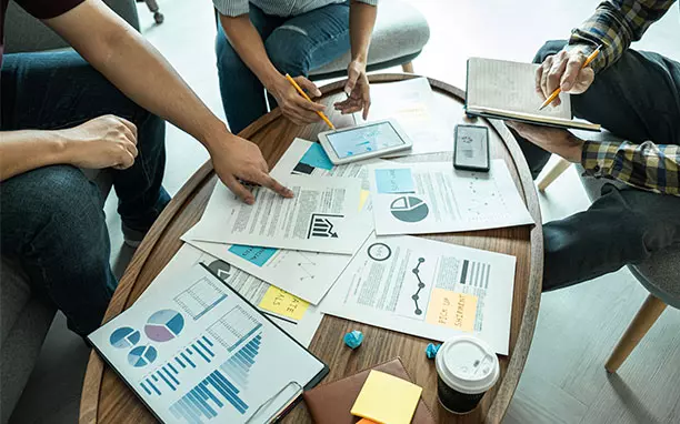 People work on creation a mobile ecommerce.