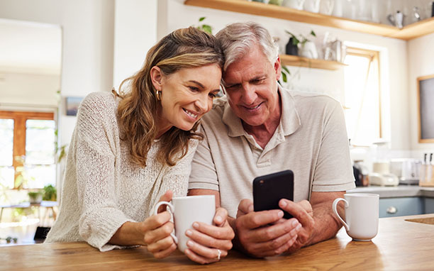 Illustrative art shows an elderly couple using their cell phones, sending metric conversion apps.